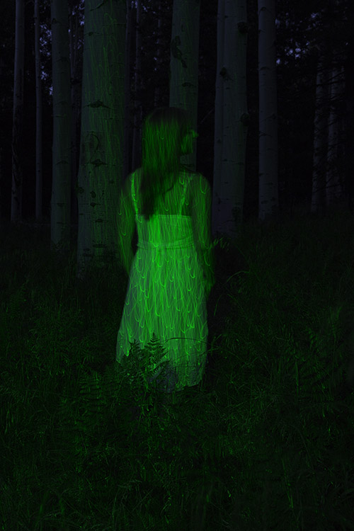 laser lighting outdoors girl lit by green laser in the woods at night
